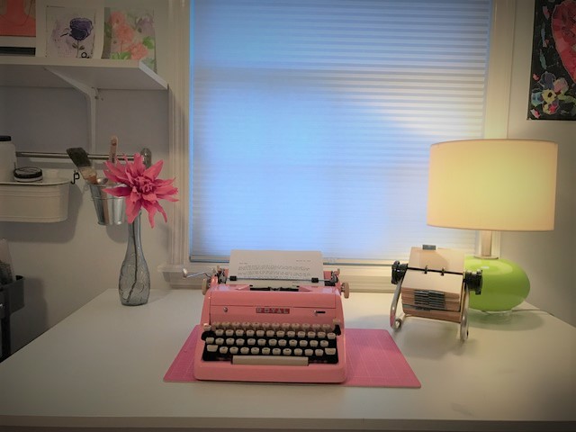 Pink Typewriter on Desk